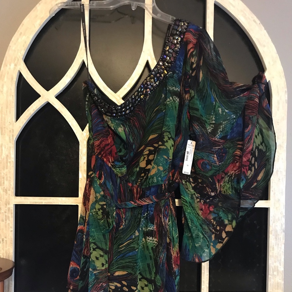 Asymmetrical one sleeved dress.